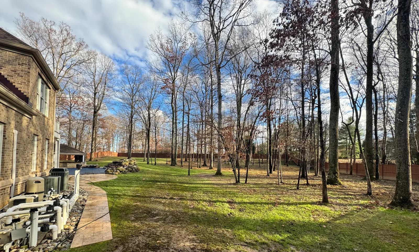 Clean backyard with paver walkway after Zilla cleanup