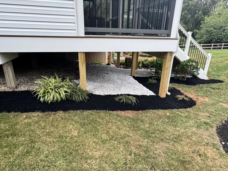 Deck area with fresh mulch after landscaping