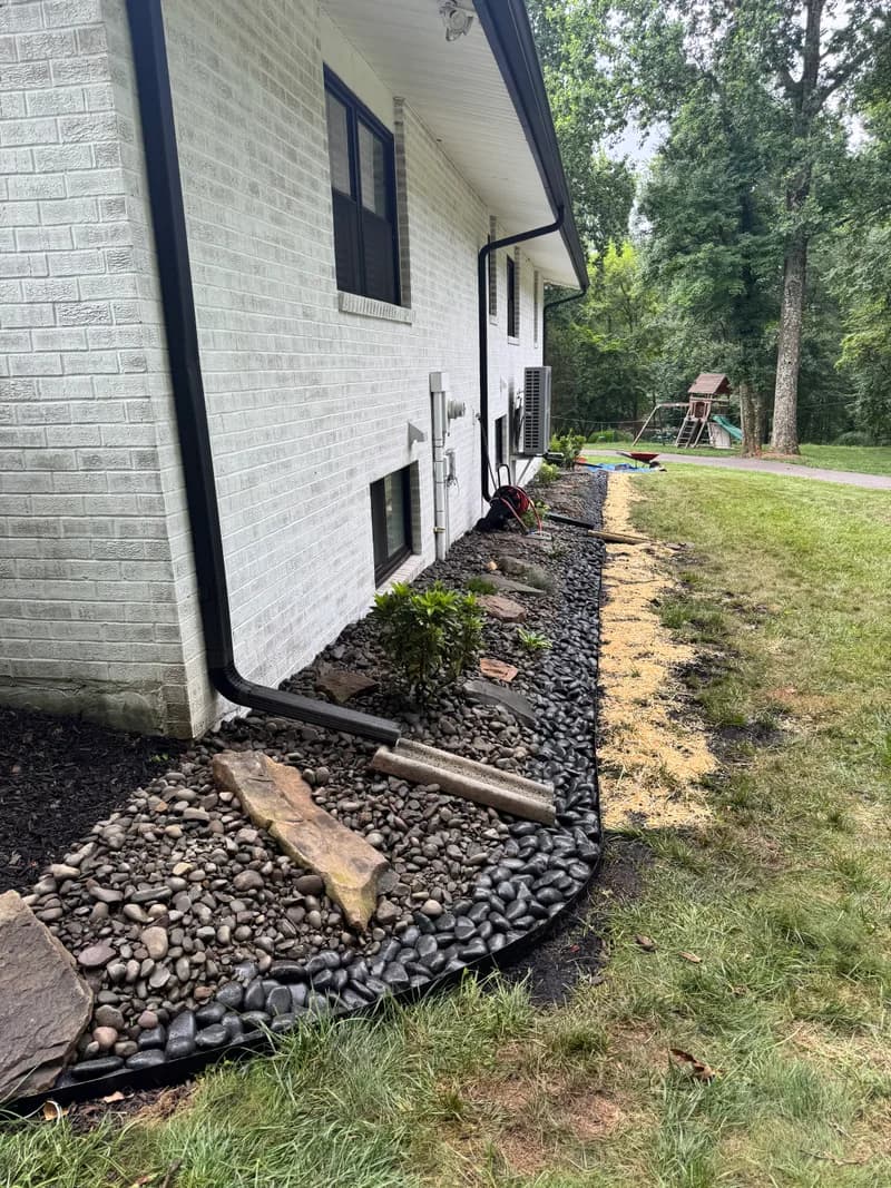 Rock landscaping along foundation